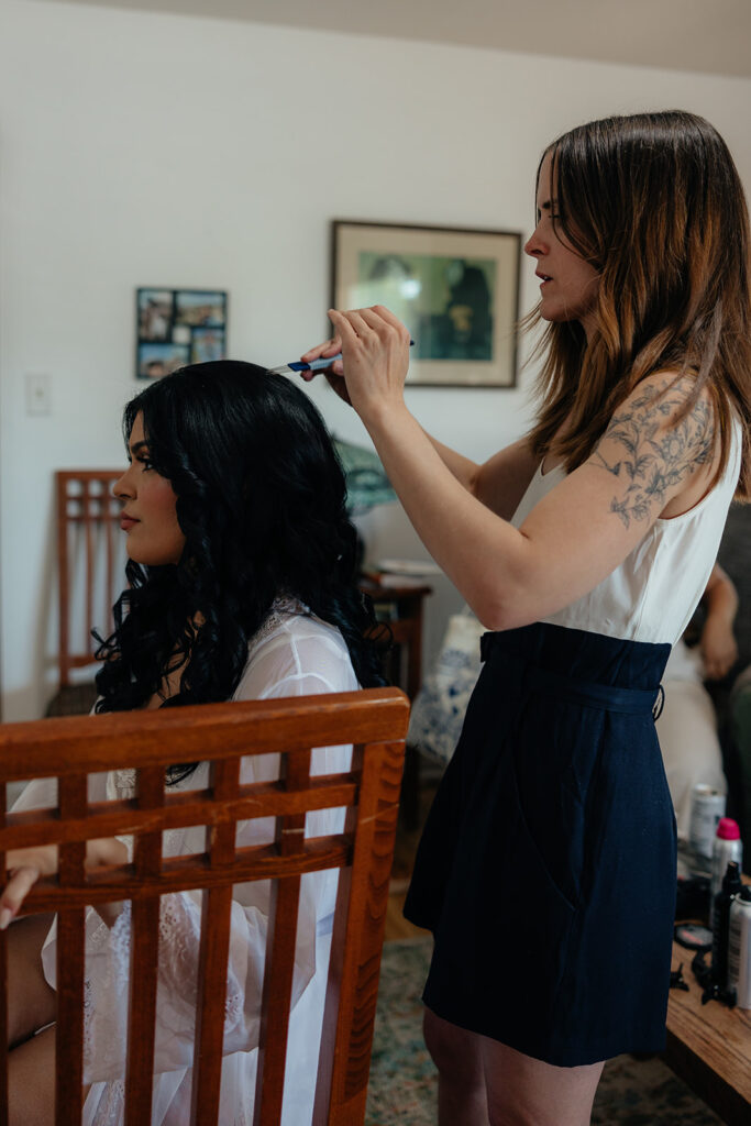 bride getting her hair done for her dream utah wedding