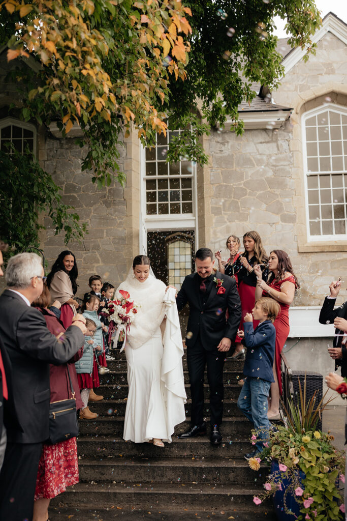 newlyweds heading to their wedding reception