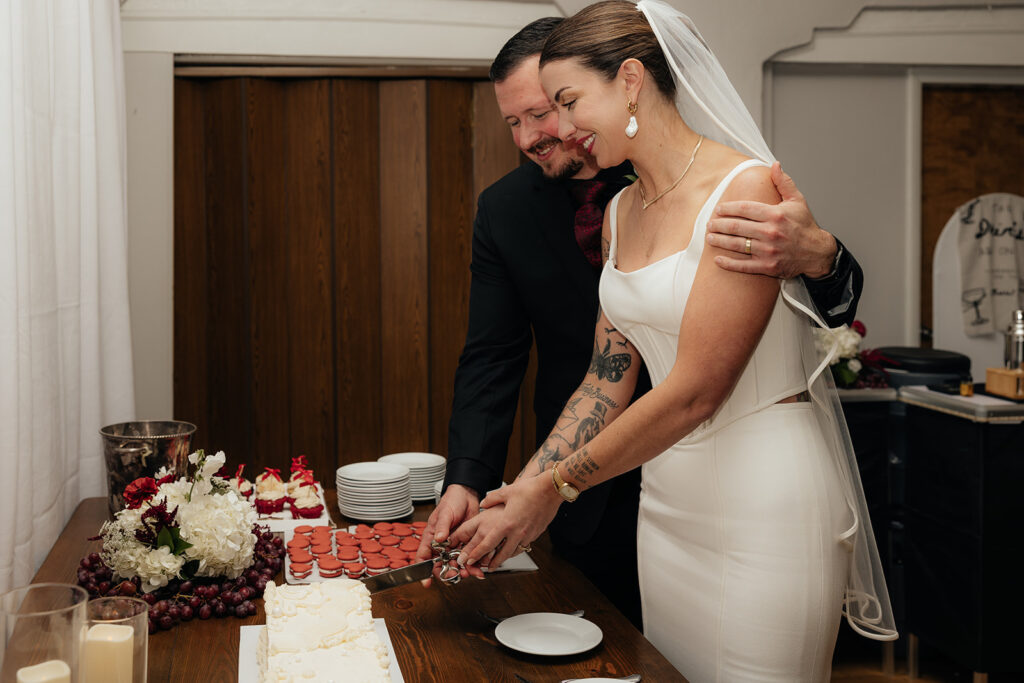 newlyweds cutting their wedding cake