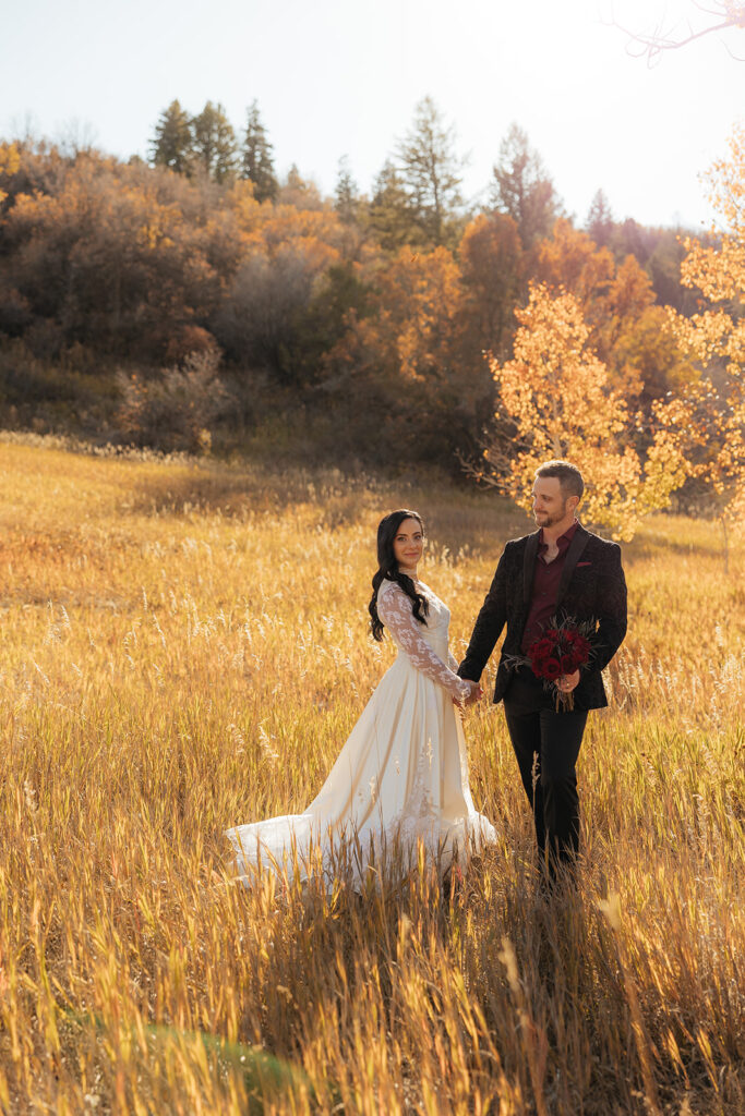 picture of the bride and groom holding hands
