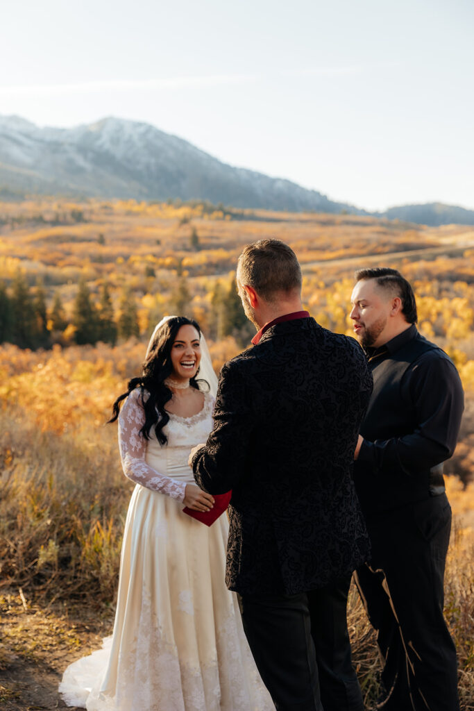 bride and groom holding hands during their ceremony