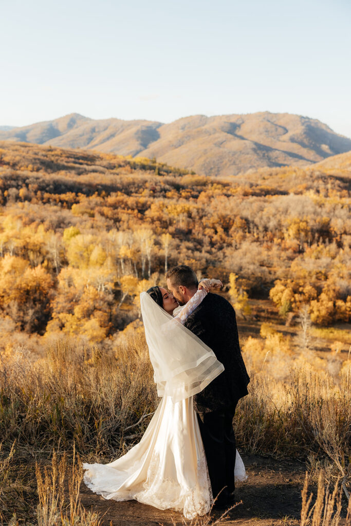 bride and groom kissing after their ceremony