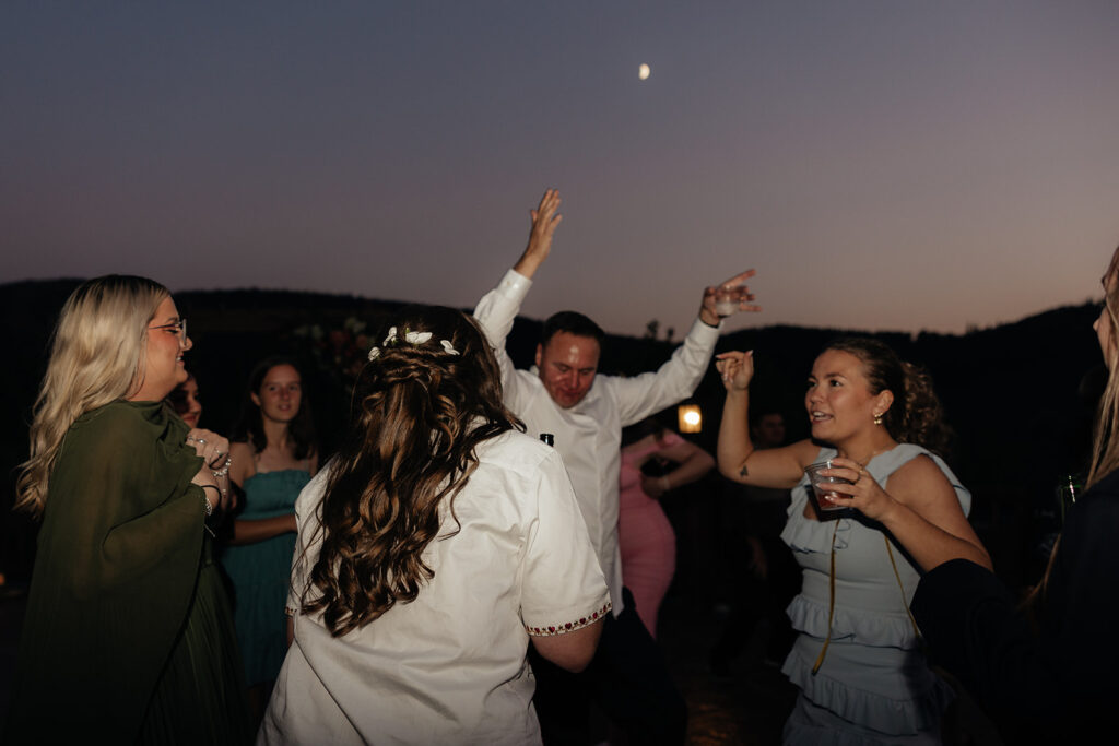 bride having the best time at her wedding reception party