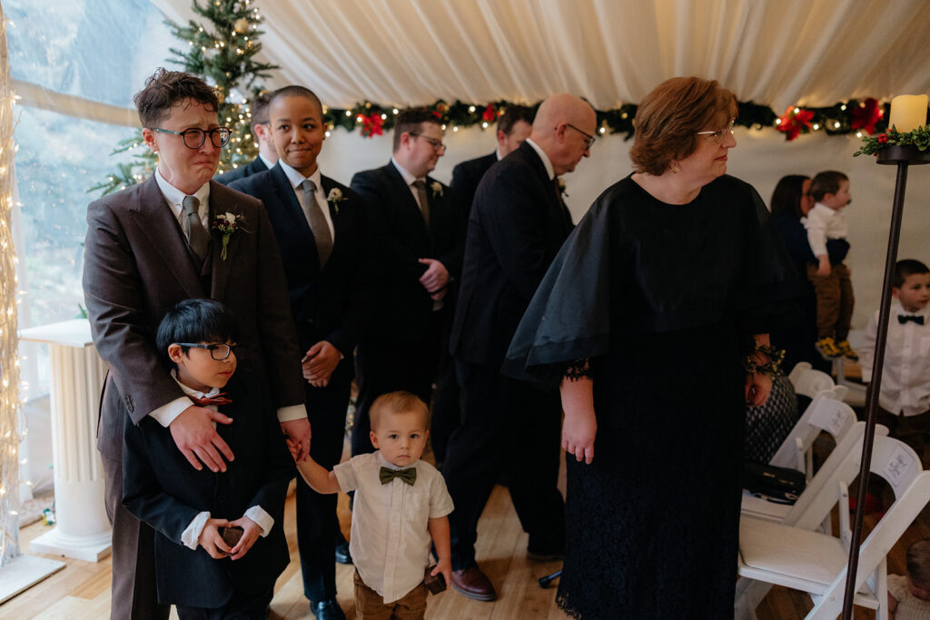 groom emotional watching the bride walk down the aisle