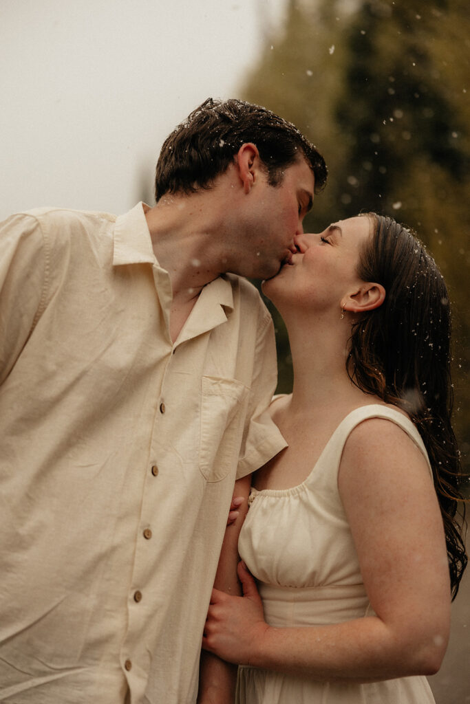 cute picture of the newly engaged couple kissing