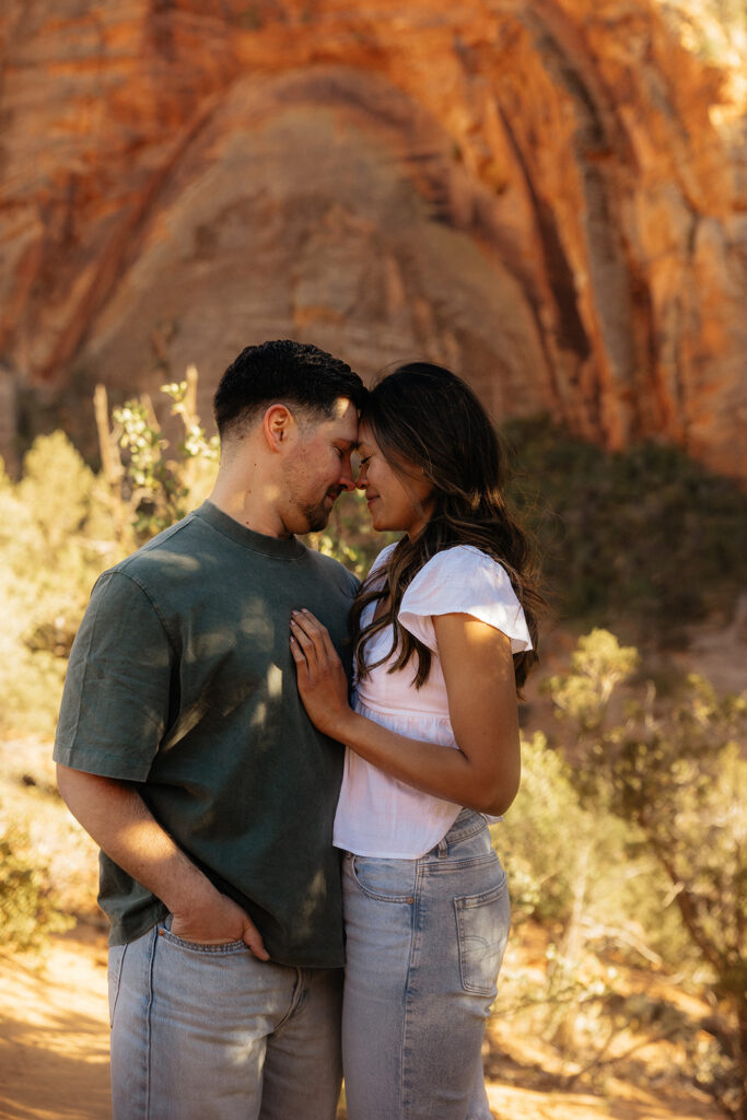 couple smiling at each other during their photoshoot