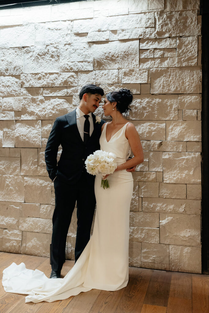 cute picture of the bride and groom smiling at each other
