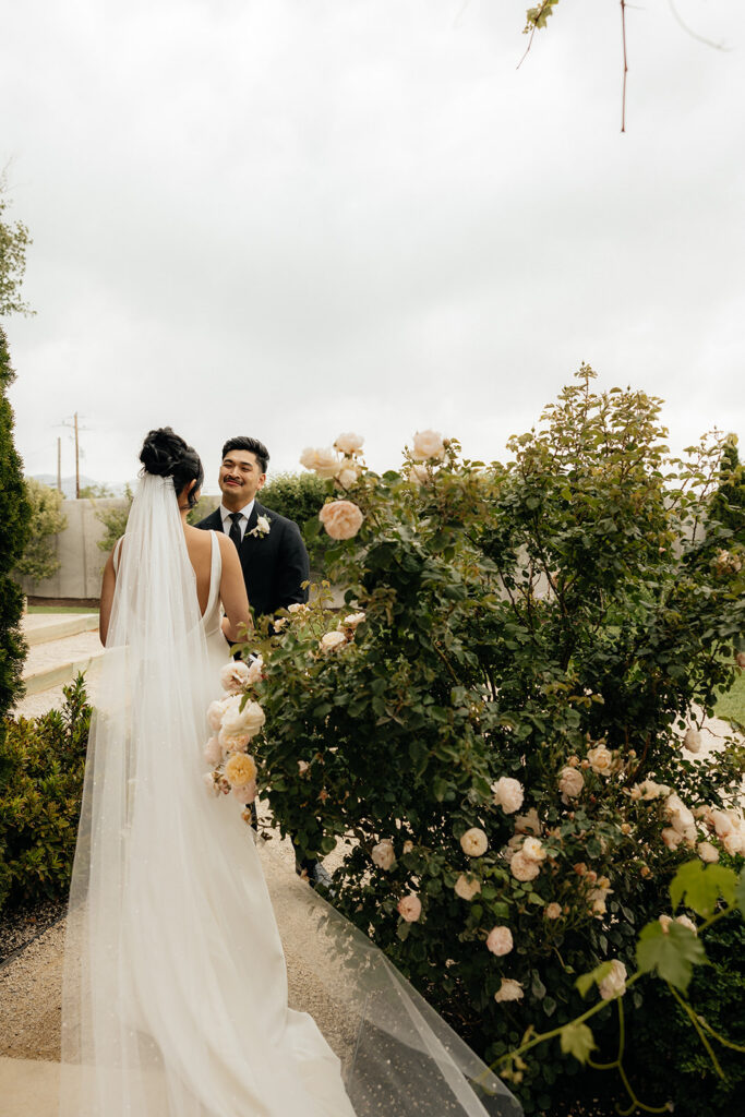 groom emotional seeing the bride in her wedding dress