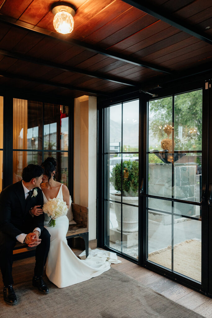 groom kissing the bride on the cheek