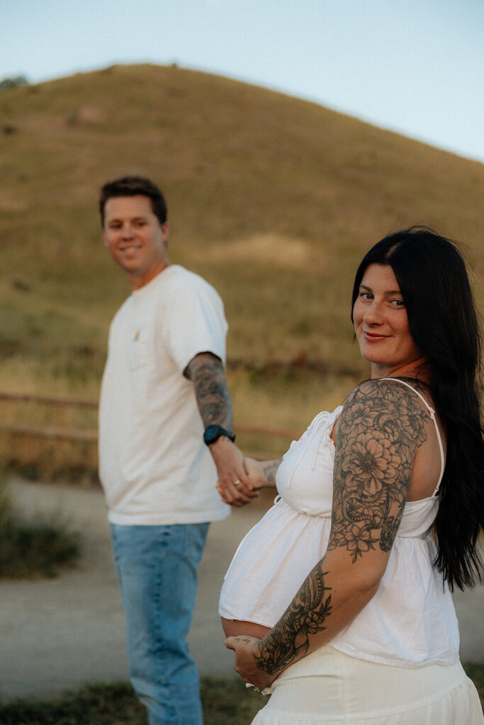 couple smiling at the camera during their session